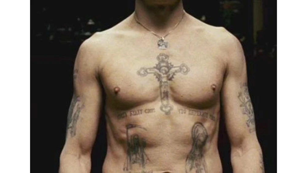 Cross tattoo on the chest